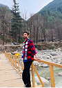 Hiker on a mountain bridge